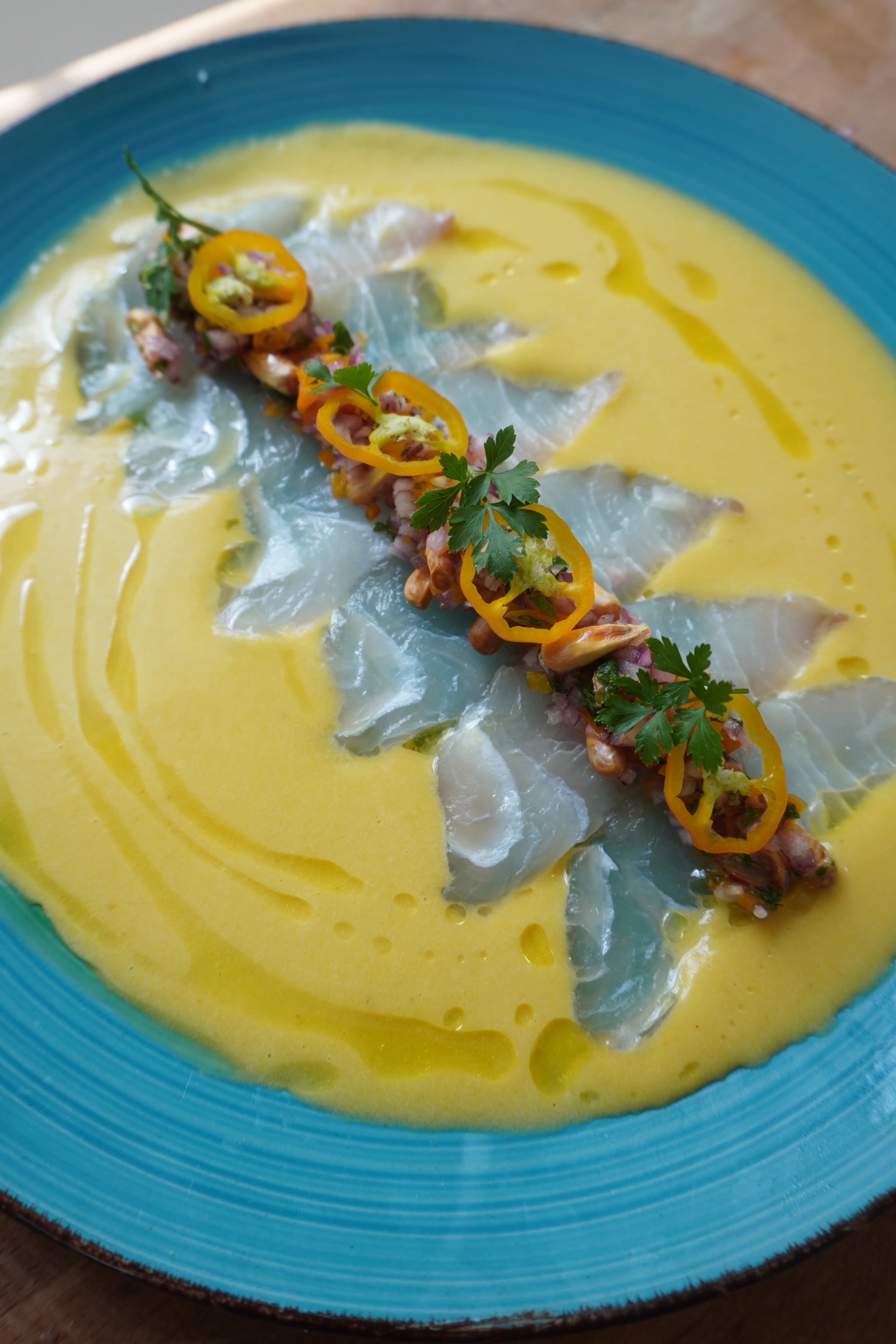 Picture for Tiradito con leche de tigre confitada de aji amarillo [Tiradito with confit tiger's milk of yellow chili pepper]