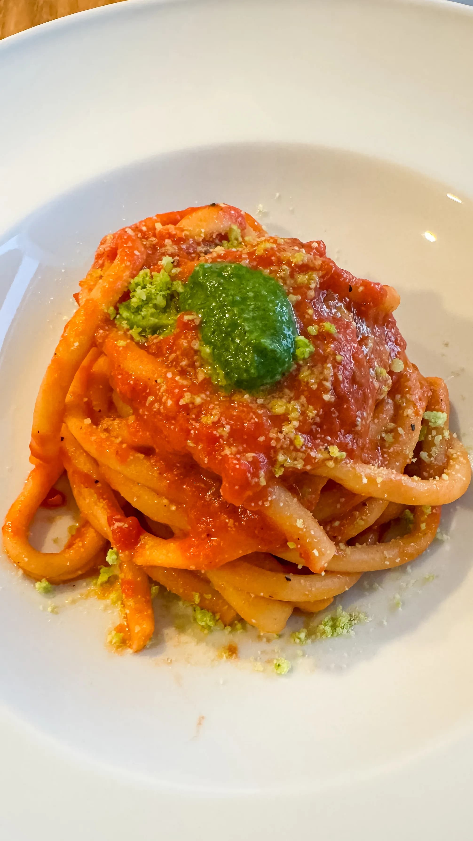 Picture for Garlic, Tomatoes, and Olive Oil Bucatini topped with basil pesto